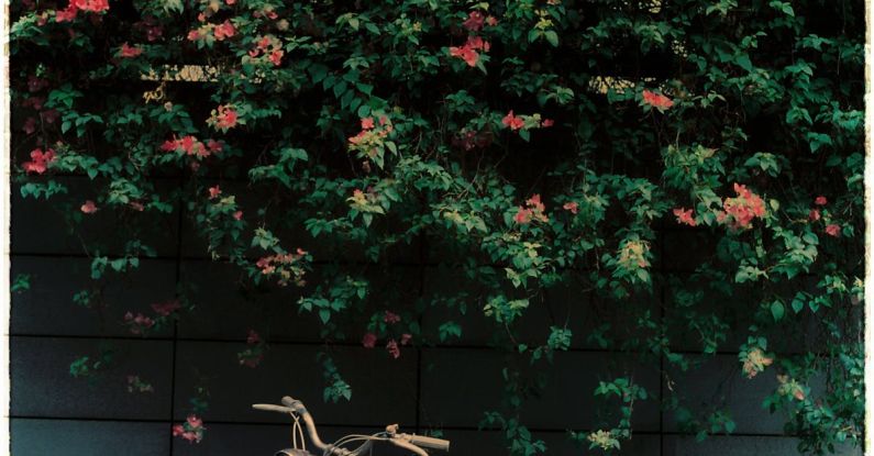 Bush Tucker - A motorcycle parked in front of a wall of flowers