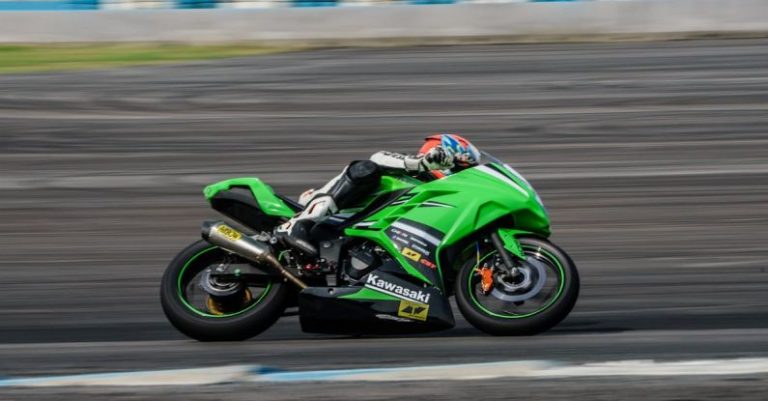 Grand Pacific Drive - Man Riding on Green Sports Bike