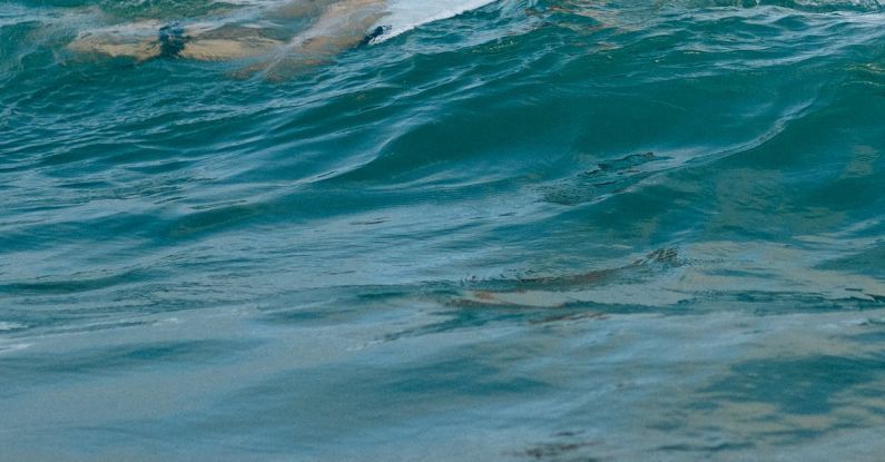 Surfing - Woman Skateboarding at Sea