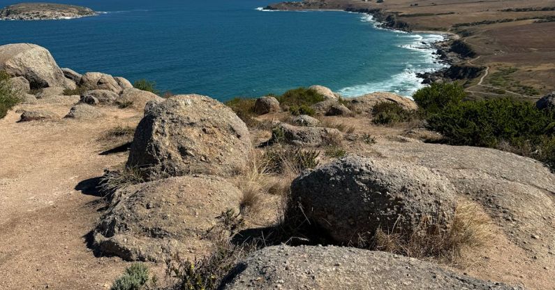 Encounter - The view from the top of a hill overlooking the ocean