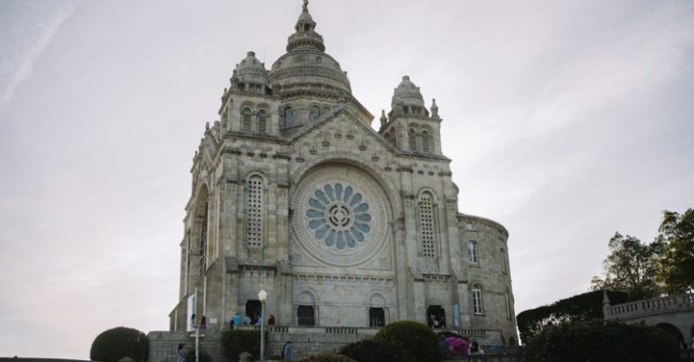 Sanctuaries - A large cathedral with a clock tower on top